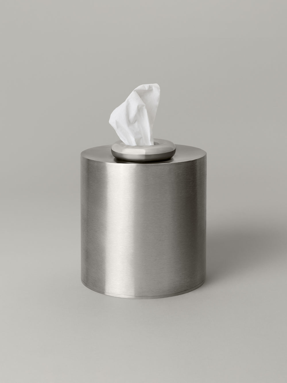 Stainless steel tissue box cover with a weighted, donut-shaped top