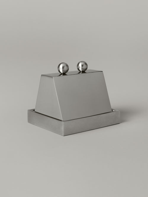Stainless steel butter dish with a domed cloche lid, brushed and polished finishes