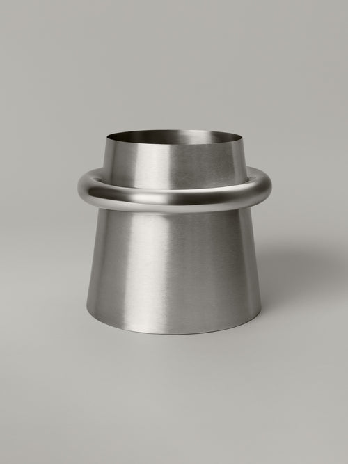 Stainless steel waste bin with a brushed body and polished ring at the rim